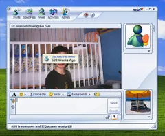 Screenshot of a meme styled as an MSN Messenger chat window. The conversation is addressed to bkennethbrown@live.com. The webcam panel shows a childhood photo of a young boy with dark hair, wearing a black shirt with flame graphics, standing in front of a white crib in a blue-painted bedroom. Overlaid on the photo is an MSN Messenger tooltip that reads 'Last Appearing Online: 620 Weeks Ago.' The messenger interface includes the standard toolbar with Invite, Send Files, Voice, Activities, and Games buttons, a text input area with Send and Search buttons, and a display picture of the classic MSN Messenger butterfly logo. At the bottom, a status bar reads 'AIM is now open and ICQ access is only $2!' The Windows XP-era green hills desktop is visible behind the window.